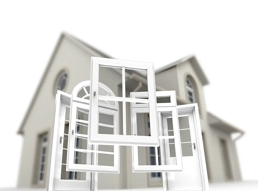 White vinyl windows and doors displayed in front of a residential house, showcasing window replacement and entry door options