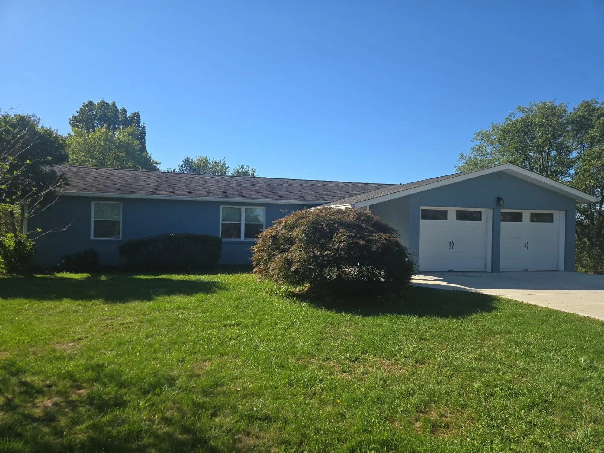 A house after a new roof replacement that was covered by insurance.