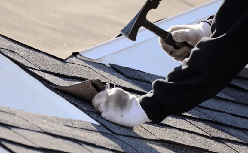 Worker in white gloves inspecting asphalt shingle roof for storm damage and missing shingles during roof inspection