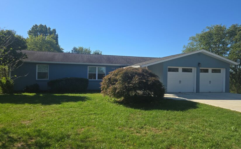 A house after a new roof replacement that was covered by insurance.