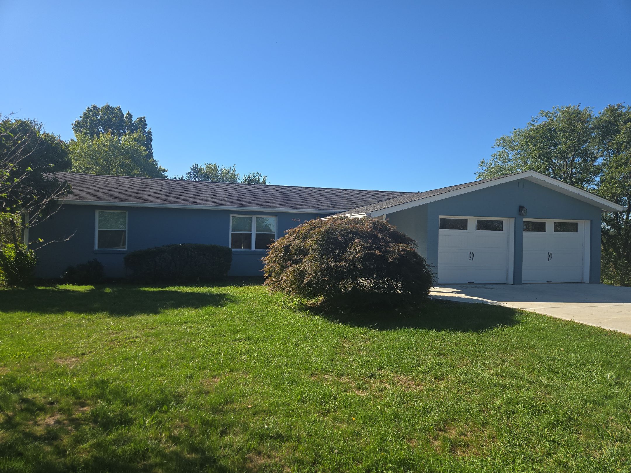 A house after a new roof replacement that was covered by insurance.